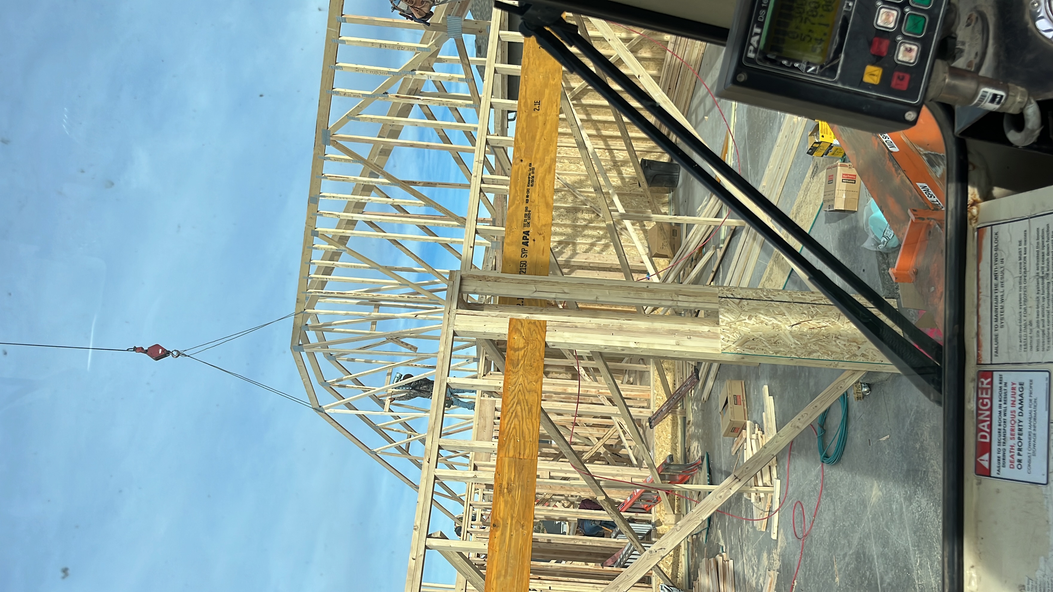 Roof trusses being set during new home framing on the Front Range